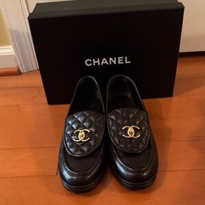 CHANEL Quilted Black Loafers with Gold Accents